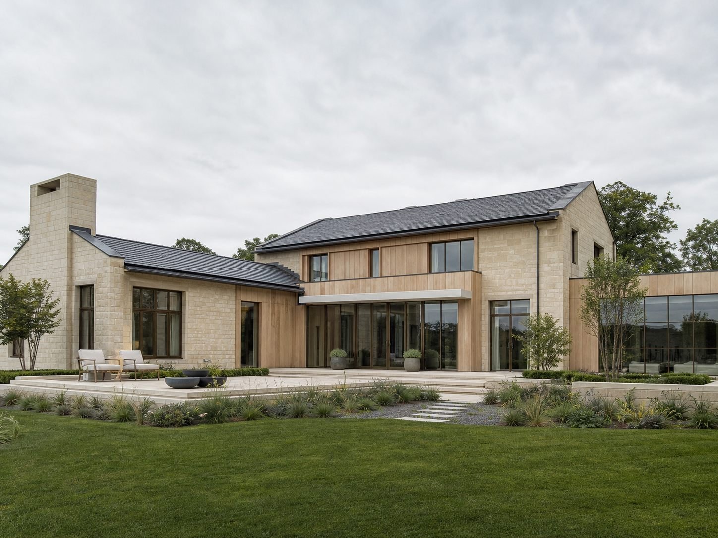 Contemporary English residence in limestone, oak and dark bronze